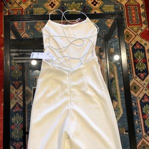 Never worn/tags on Tiger Mist White Jumpsuit XS.